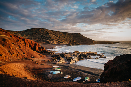 Fishing boats dry on shore near village of El Golfoの写真素材