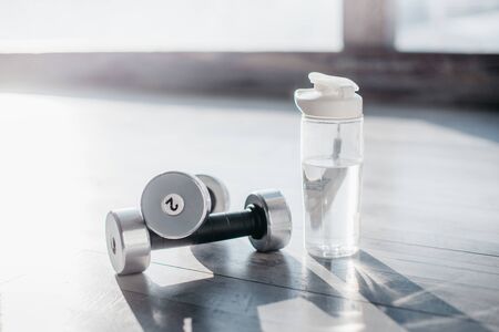close-up of silver dumbbells lying on floor, close upの写真素材