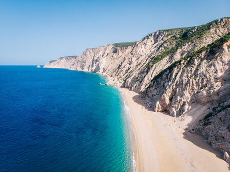 Aerial view of a clean white sandy beach on the shores of a beautiful turquoise sea. Greece.の写真素材