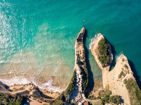 Aerial view of beautiful beach with blue water. Channel of Love on island of Corfu, Greece. Top down view.の写真素材