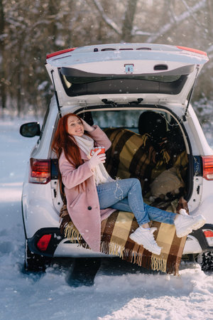 Winter holidays. Happy young caucasian woman is enjoying outdoor recreation on sunny winter day.
