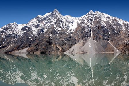 Snow mountain and lake at southwest Chinaの写真素材