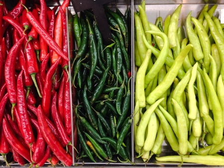 Fresh mixed chili peppers ready for saleの素材