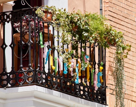 fake firecrackers on a balcony in spain for a traditional fairの写真素材