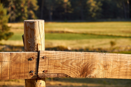 Wood fence on a countryside backgroundの写真素材