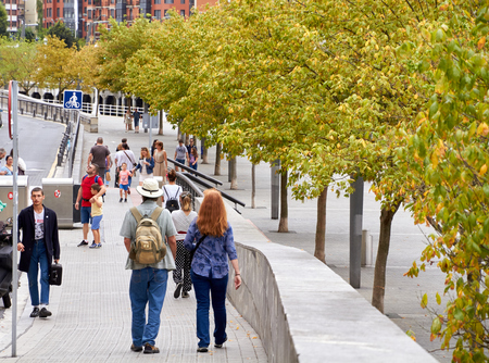 BILBAO, SPAIN, CIRCA AUGUST 2018, people walking next to the riverのeditorial素材
