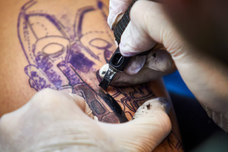 ALICANTE TATTOO FAIR CIRCA 2018 closeup tattoo artist workingのeditorial素材