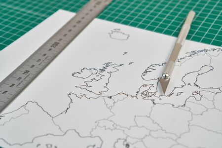 europe map with a ruler and a cutterの写真素材