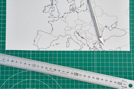 europe map with a ruler and a cutter