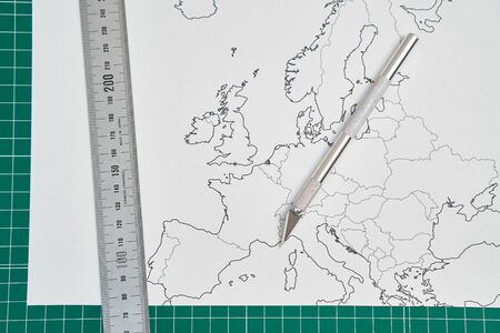 europe map with a ruler and a cutterの写真素材