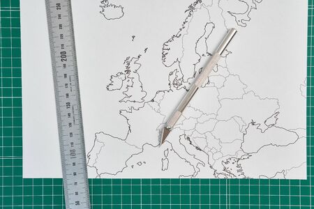 europe map with a ruler and a cutterの写真素材