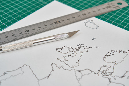 europe map with a ruler and a cutter