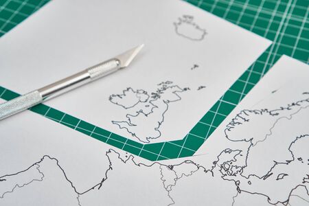 europe map with a ruler and a cutterの写真素材