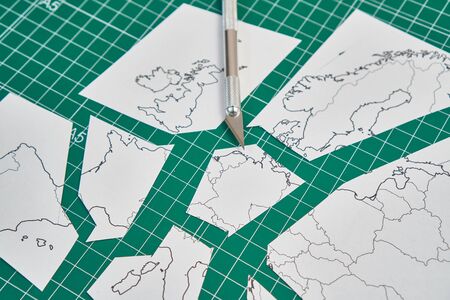 europe map with a ruler and a cutterの写真素材