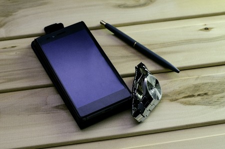 watch phone and penの写真素材