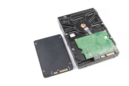 Repair and maintenance of Hdd - hard disk drive. Hard disk repair concept, computer industry. Disassembled hard drive from the computer 3.5' SATA on white background.の写真素材