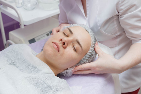 woman getting ultrasound skin cleaning at beauty salon