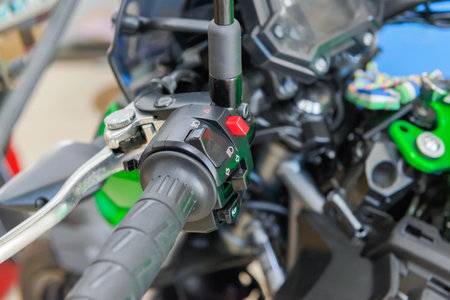 The master performs maintenance on the motorcycle.
