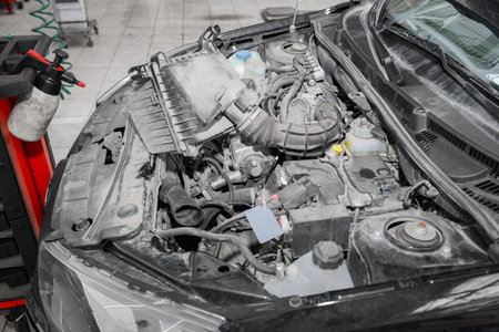 Automobile Engine close up. Repair and maintenance of the car engine in the service.