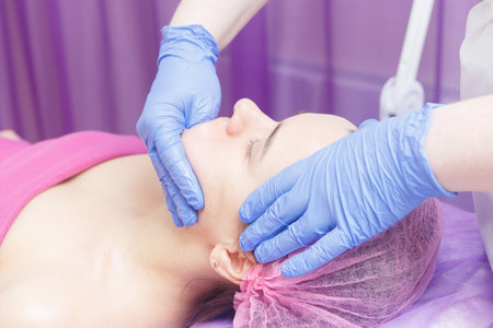 Buccal massage procedure provided to the client.の写真素材