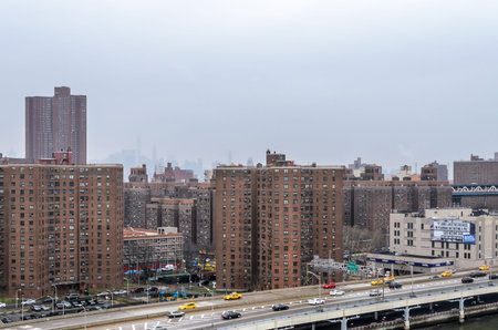 Manhattan New York City Buildings Covered in Fog. Shot Taken from Brooklyn Bridge. Lower Manhattan,...