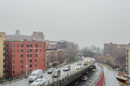 Cars Driving in Traffic on Brooklyn Roads in Rain. Winter Season in New York, NY, USAの写真素材