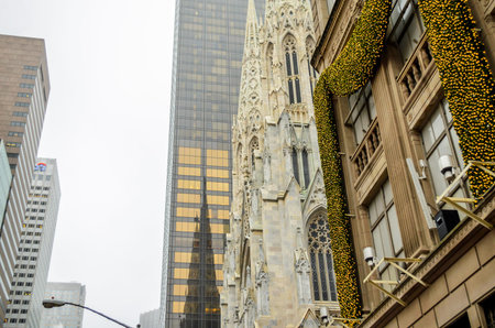 St Patrick Cathedral Reflected in the Nearby Skyscraper Building in Manhattan. Store Next to the...