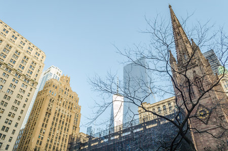 Low Angle View of Trinity Church Top and Other Skyscrapers in Wall Street, Financial District, Manhattan. Freedom Tower in Background. New York City, USAのeditorial素材