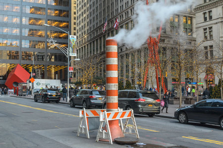 Typical Orange Steam Pipe in the Middle of the Road in Financial District, Manhattan, New York City, USAのeditorial素材