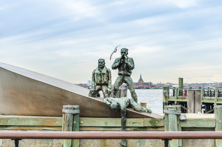 American Merchant Mariner`s Memorial. Statue of Refugees Calling for Help in Battery Park, Lower Manhattan, New York City, USAのeditorial素材