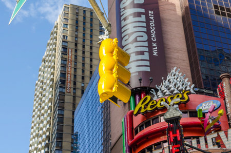 Close Up View of Typical Yellow Traffic Lights in Manhattan Times Square. Fancy Billboards in Background. New York City, USAのeditorial素材