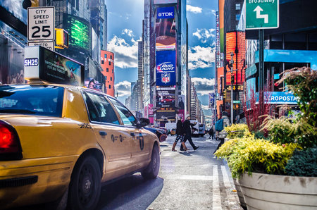 Manhattan Times Square View Behind a Yellow Cab. Beautiful District Full of LED Screens, Billboards...