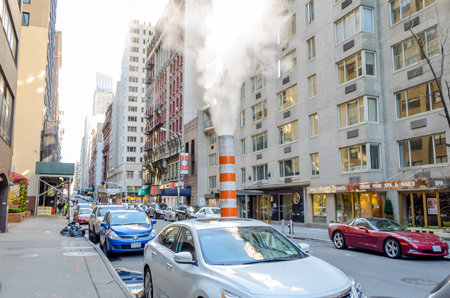Typical Orange Steam Pipe in the Middle of the Road in Financial District, Manhattan, New York City, USAのeditorial素材