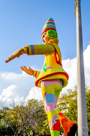 Exhibition of a Carnival Figure of a Giant Clown with Multicolored Costume and a Hat. Big Traditional Sculpture at the Annual Carnaval Festival in Patra City, Greece, Europe. Blueの写真素材