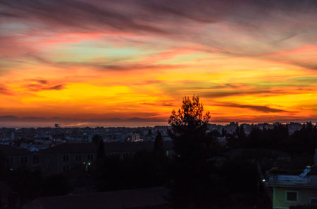 Patras Skyline During Sunset. Beautiful Sky and Cloud Colors over the City. Residential District with Seafrontの写真素材