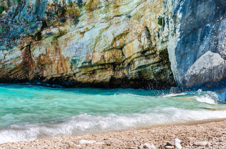 Beautiful Seascape with Turquoise Water and Rocks on the Shore. Wild Natural Environment with the Sea that Meets the Steep Rocks. Zante Island, Zakynthos, Greece, Europe.の写真素材