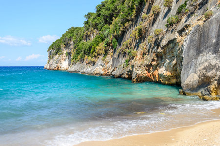 Beautiful Beach on Zante or Zakynthos Island in Greece, Europe. The Turquoise Colored Sea Meets the Steep Rocks. Wild Rugged Coastline.の写真素材