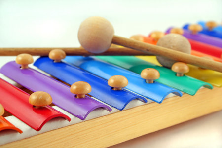 colourful child's glockenspiel with two crossed mallets