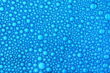 background of small blue bubbles forming a beautiful ornamentの写真素材