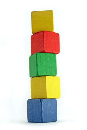 colorful wooden cilds blocks stacked into a very high towerの写真素材