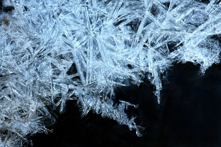 close up of blue ice crystals forming spiky ornamentsの写真素材