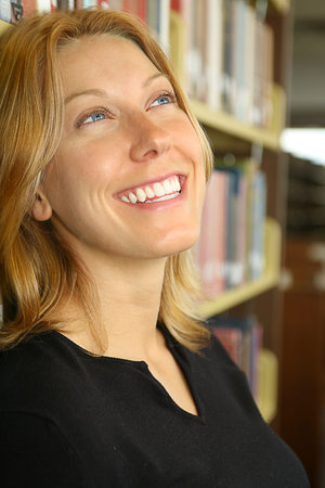 attractive female university student in the library dreaming of a bright future that her education...