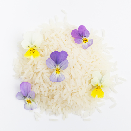 Healthy Eating Concept, rice and flowers on a white backgroundの写真素材