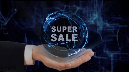 Painted hand shows concept hologram Super sale on his hand. Drawn man in business suit with future technology screen and modern cosmic backgroundの写真素材