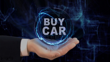 Painted hand shows concept hologram Buy car on his hand. Drawn man in business suit with future technology screen and modern cosmic backgroundの写真素材