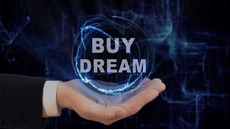 Painted hand shows concept hologram Buy dream on his hand. Drawn man in business suit with future technology screen and modern cosmic backgroundの写真素材