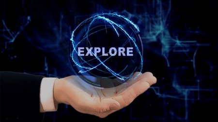 Painted hand shows concept hologram Explore on his hand. Drawn man in business suit with future technology screen and modern cosmic backgroundの写真素材