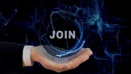 Painted hand shows concept hologram Join on his hand. Drawn man in business suit with future technology screen and modern cosmic backgroundの写真素材