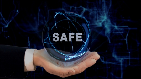 Painted hand shows concept hologram Safe on his hand. Drawn man in business suit with future technology screen and modern cosmic backgroundの写真素材
