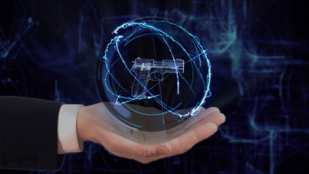 Painted hand shows concept hologram 3d gun on his hand. Drawn man in business suit with future technology screen and modern cosmic backgroundの写真素材